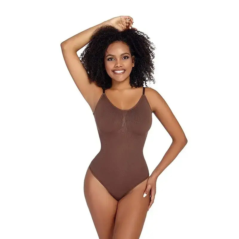Brown ribbed thong bodysuit shapewear on smiling woman with curly hair posing with hand on head