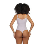 Back view of ribbed thong bodysuit shapewear in light color with adjustable straps by The Lady's Haven Boutique