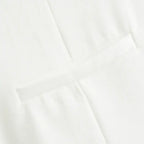 Close up of white fabric detail from summer office vest and shorts outfit by The Lady's Haven Boutique
