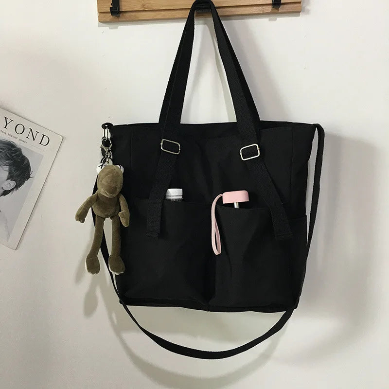 Stylish waterproof ladies handbag in black with pockets for convenience and charm accessory