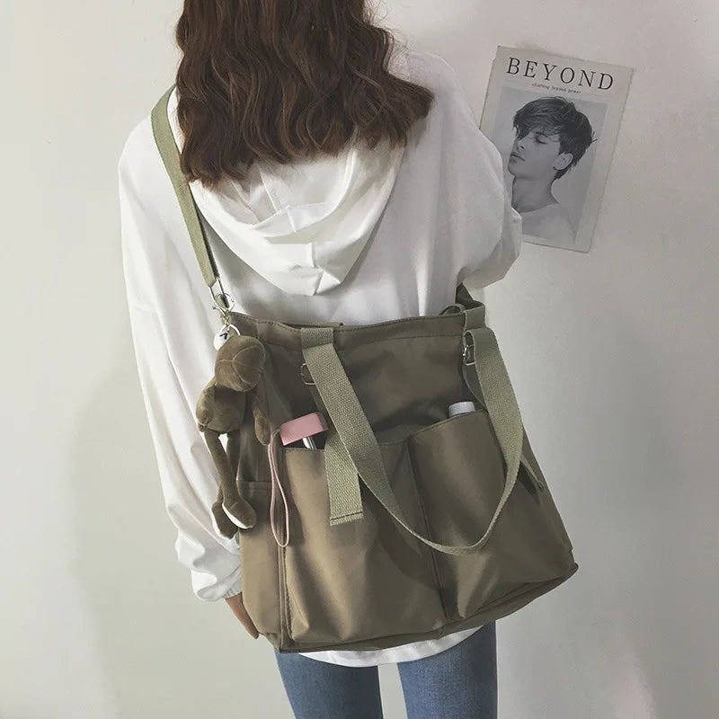 Stylish waterproof ladies handbag in khaki color with multiple pockets for everyday use