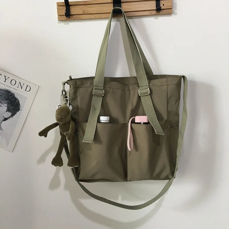 Stylish waterproof ladies handbag in khaki with multiple pockets and a cute keychain
