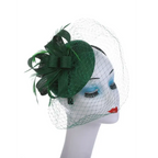 Elegant green wedding pillbox hat adorned with feathers and a netting veil for stylish occasions