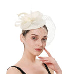 Elegant wedding pillbox hat with netting and floral detail, perfect for bridal or special events