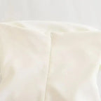 Close-up of white strapless corset top with zipper detail from The Lady's Haven Boutique