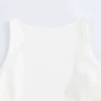 Close-up of a white summer party mini dress sleeveless top from The Lady's Haven Boutique