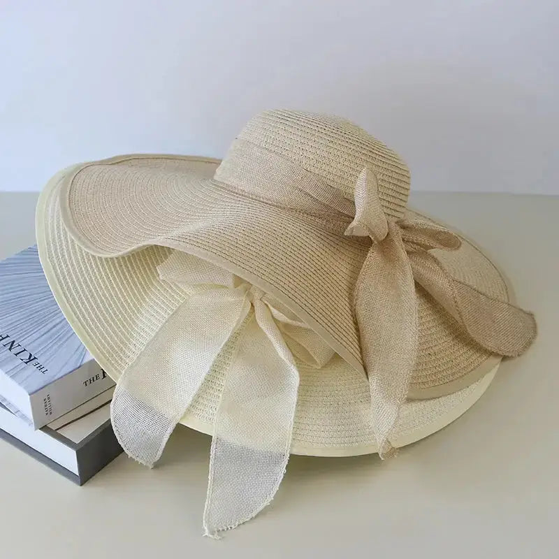 Elegant wide brim floppy hat for women with a beautiful bow, perfect for sunny days