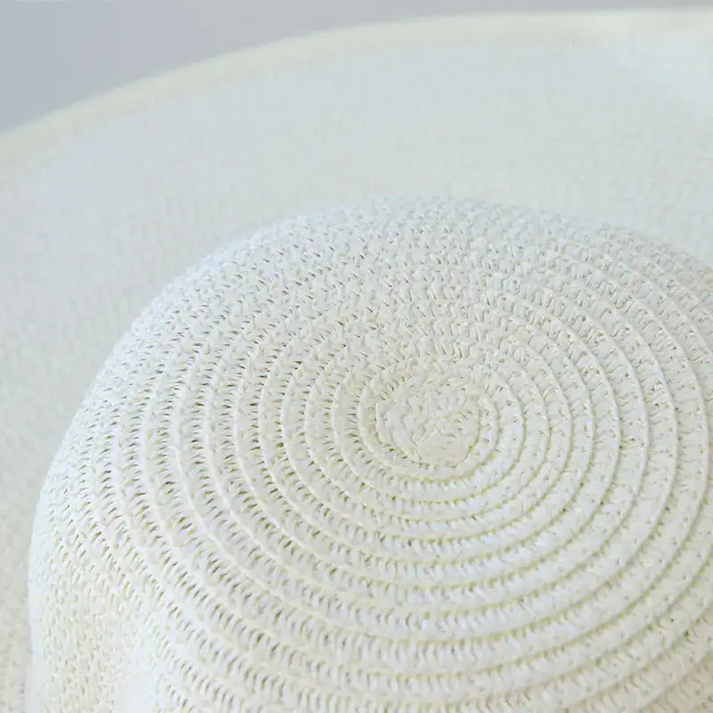 Textured cream wide brim floppy hat for women, perfect for sunny days and stylish outings