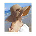 Wide brim floppy hat for women in beige with a decorative bow, perfect for beach outings