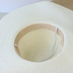 Inside view of a wide brim floppy hat for women with a soft, lightweight design perfect for sun protection