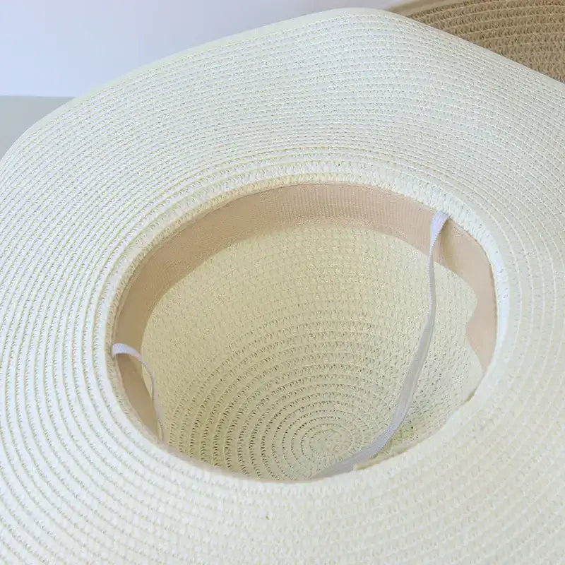 Inside view of a wide brim floppy hat for women with a soft, lightweight design perfect for sun protection
