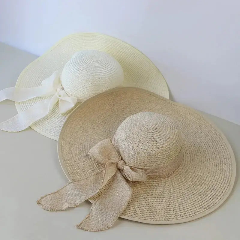 Wide brim floppy hat for women in beige and white with stylish ribbon detail from The Lady's Haven Boutique