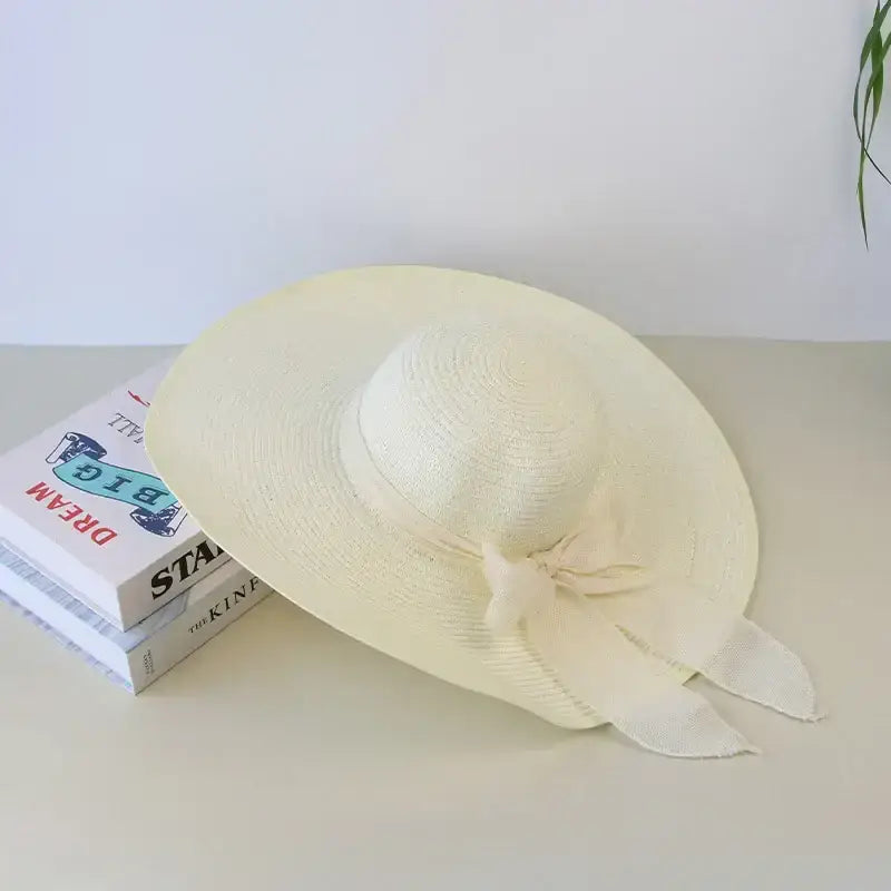 Elegant wide brim floppy hat for women from The Lady's Haven Boutique with stylish ribbon detail