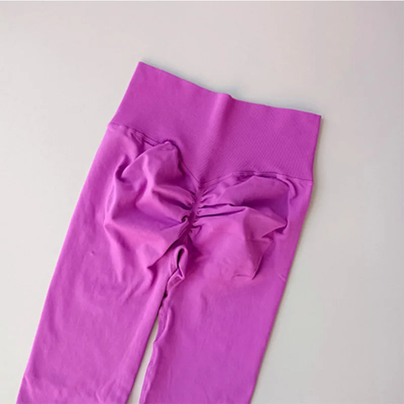 Purple women hip lift leggings with a stylish bow detail for a flattering fit