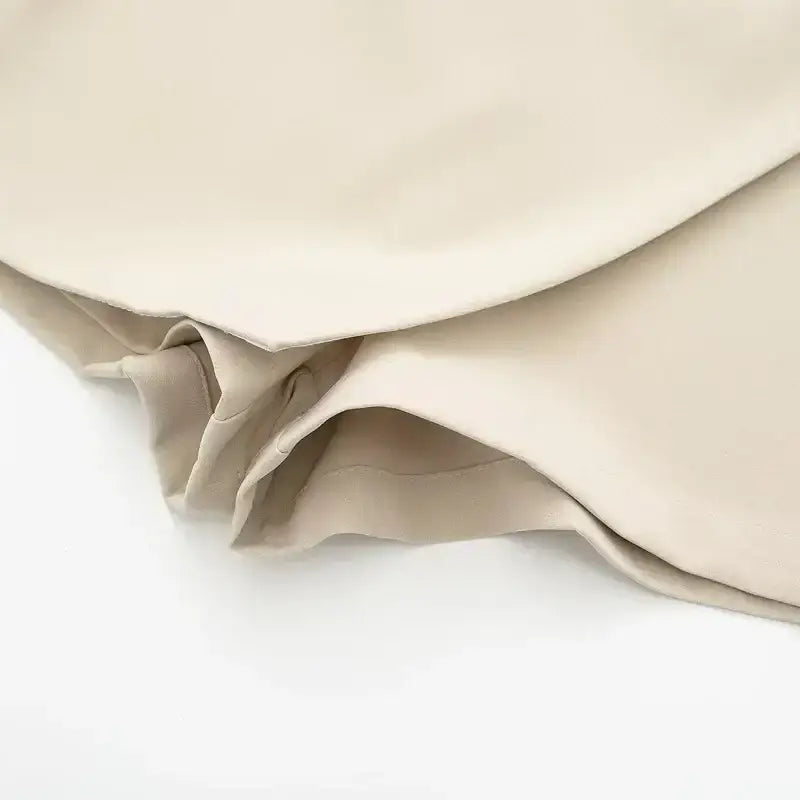 Close-up detail of beige fabric hem on fashionable skorts from The Lady's Haven Boutique