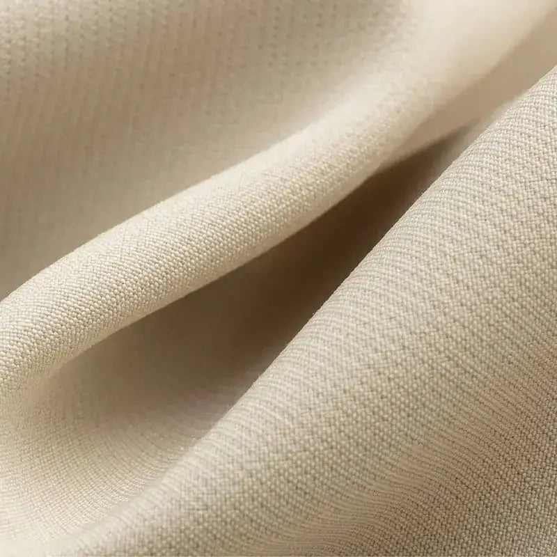 Close-up of beige fabric texture used in fashionable skorts from The Lady's Haven Boutique