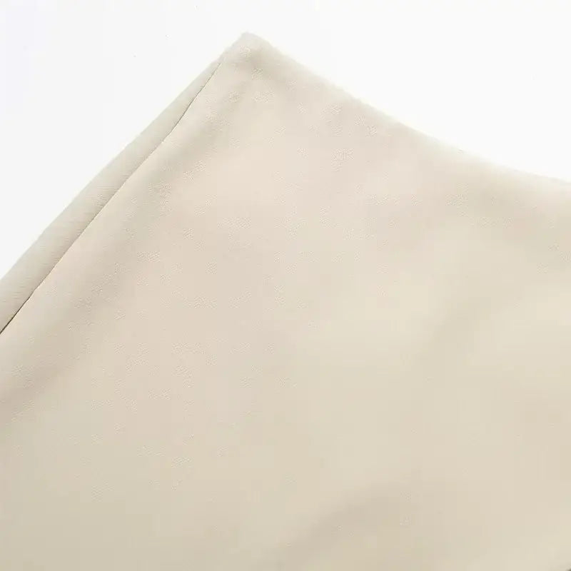 Beige fabric close-up from The Lady's Haven Boutique showcasing material for fashionable skorts