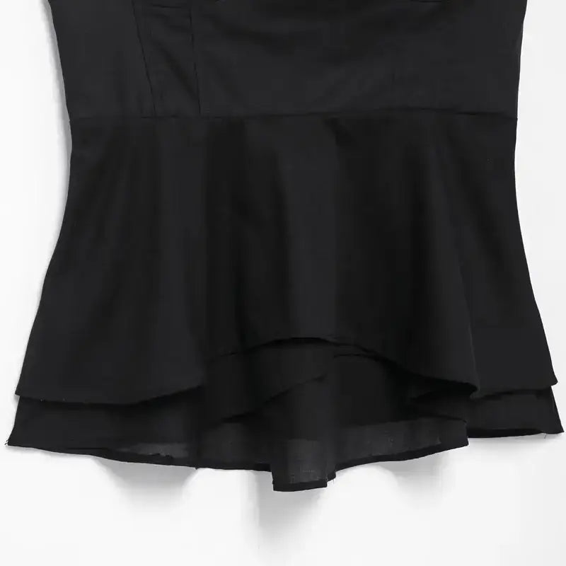 Black sexy bow backless slip top with layered hem detail from The Lady's Haven Boutique