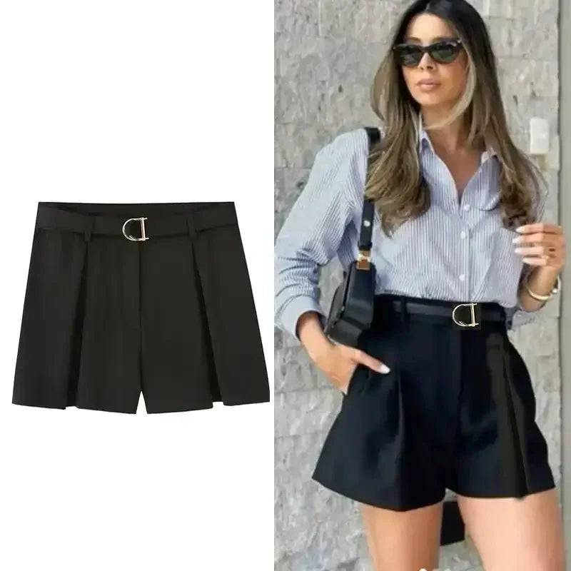 Black high waisted shorts with belt detail styled with striped button-up shirt and sunglasses