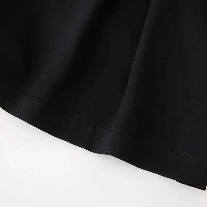 Close-up detail of black high waisted shorts fabric and hem stitching from The Lady's Haven Boutique