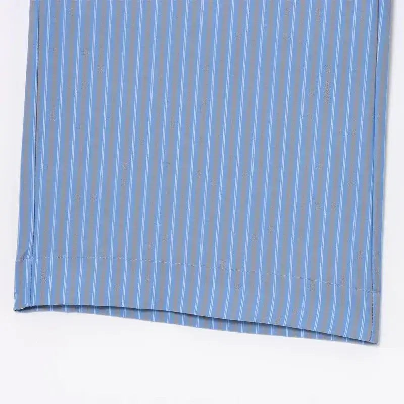 Close-up of blue striped fabric detail from casual summer lounge set by The Lady's Haven Boutique