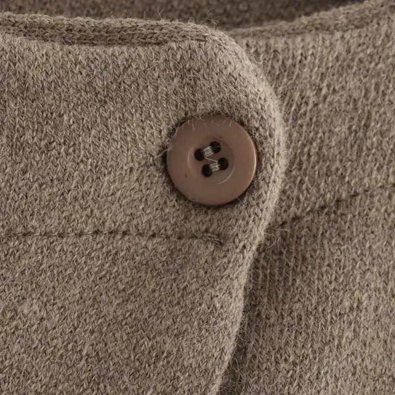 Close-up of brown button detail on knitted long sleeve cardigan for ladies from The Lady's Haven Boutique