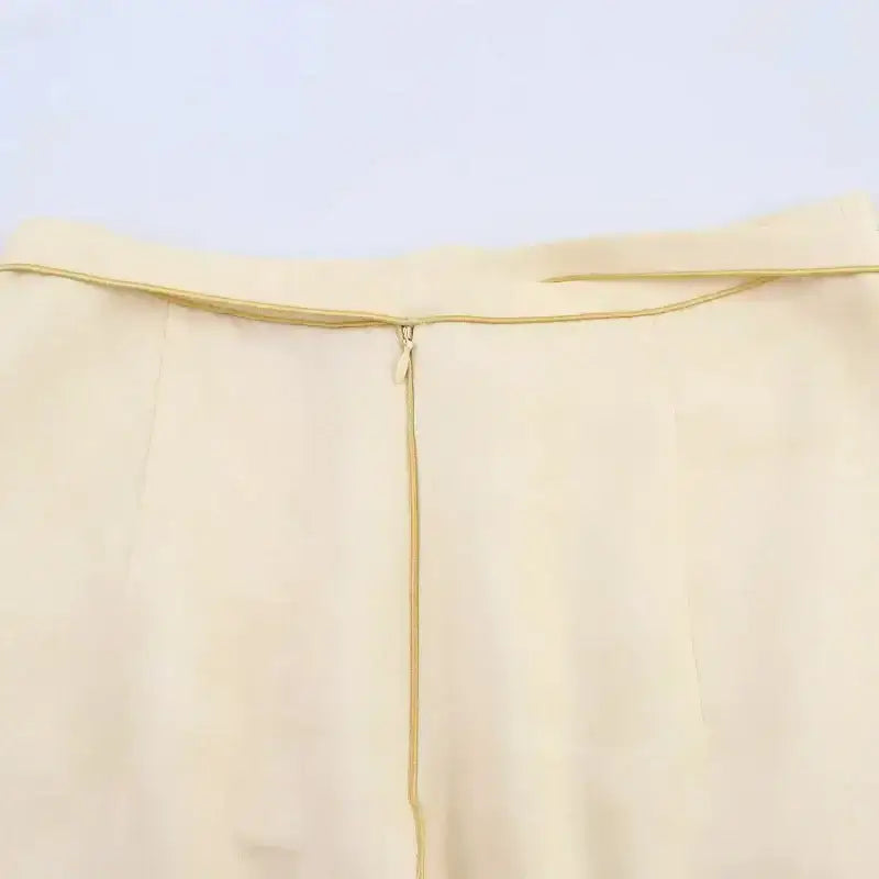 Close-up of beige fashion casual skirts with print featuring a hidden zipper closure at the waist