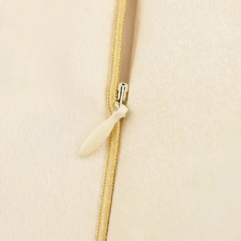 Close-up of a beige zipper detail on fashion casual skirts with print from The Lady's Haven Boutique