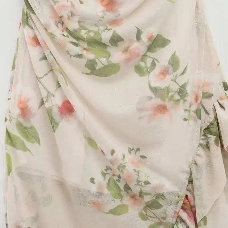 Close-up view of sleeveless tie back floral dress with soft pastel flower pattern by The Lady's Haven Boutique