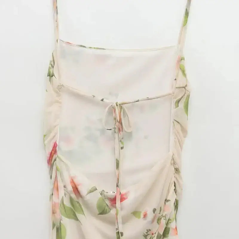 The Lady's Haven Boutique sleeveless tie back floral dress with delicate straps and soft pastel pattern