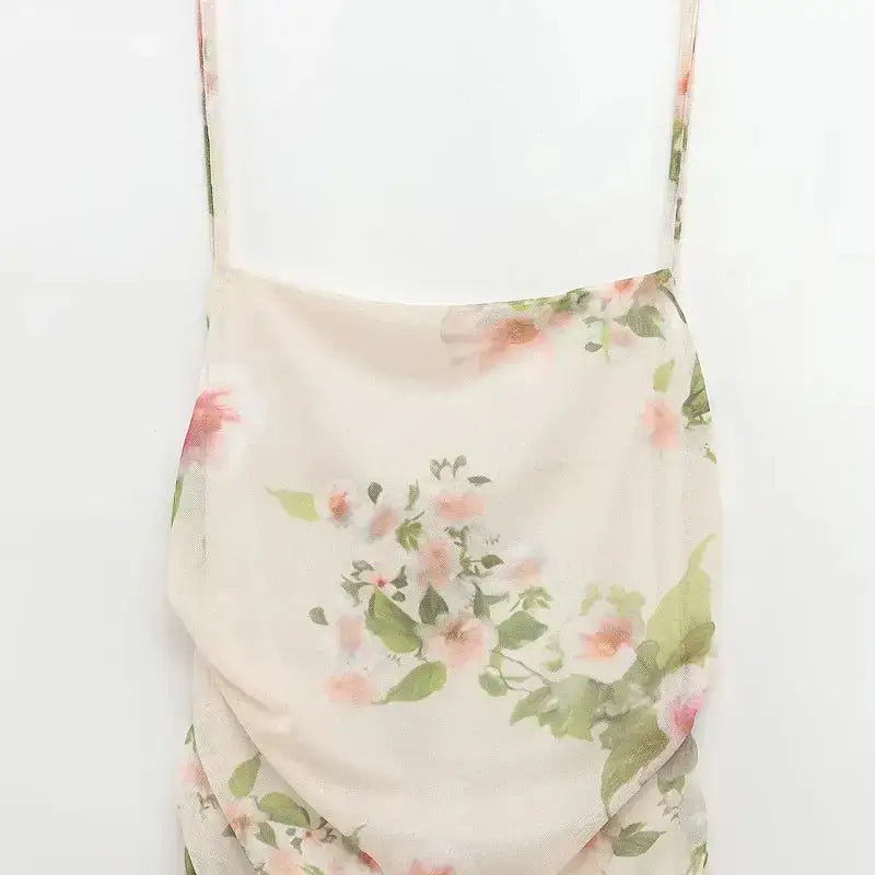 The Ladys Haven Boutique sleeveless tie back floral dress with soft pink and green flower prints