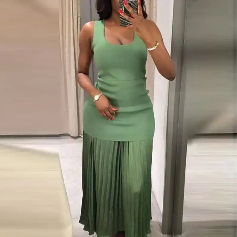 The Lady's Haven Boutique sleeveless green maxi dress with fitted bodice and pleated skirt
