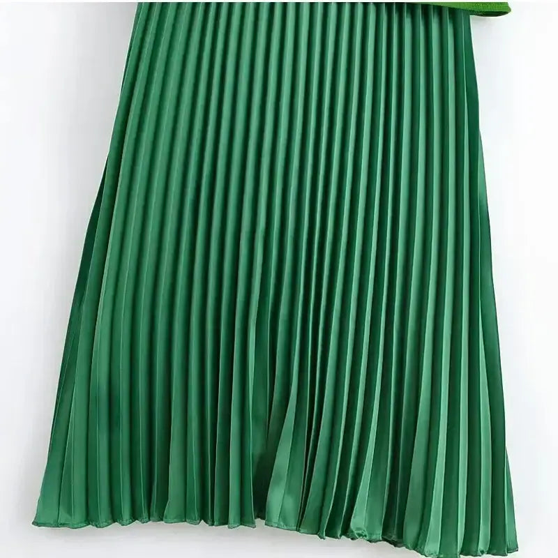 Pleated fabric detail of sleeveless green maxi dress from The Lady's Haven Boutique