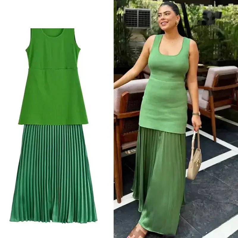 Sleeveless green maxi dress with a fitted top and pleated skirt from The Lady's Haven Boutique