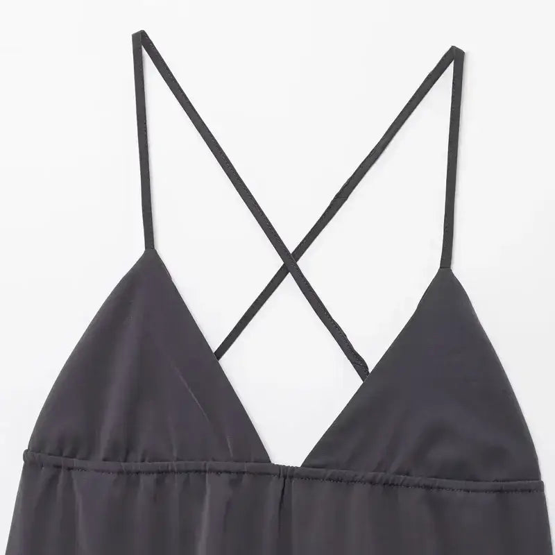 Close-up of black sleeveless backless midi dress with thin crisscross straps from The Lady's Haven Boutique