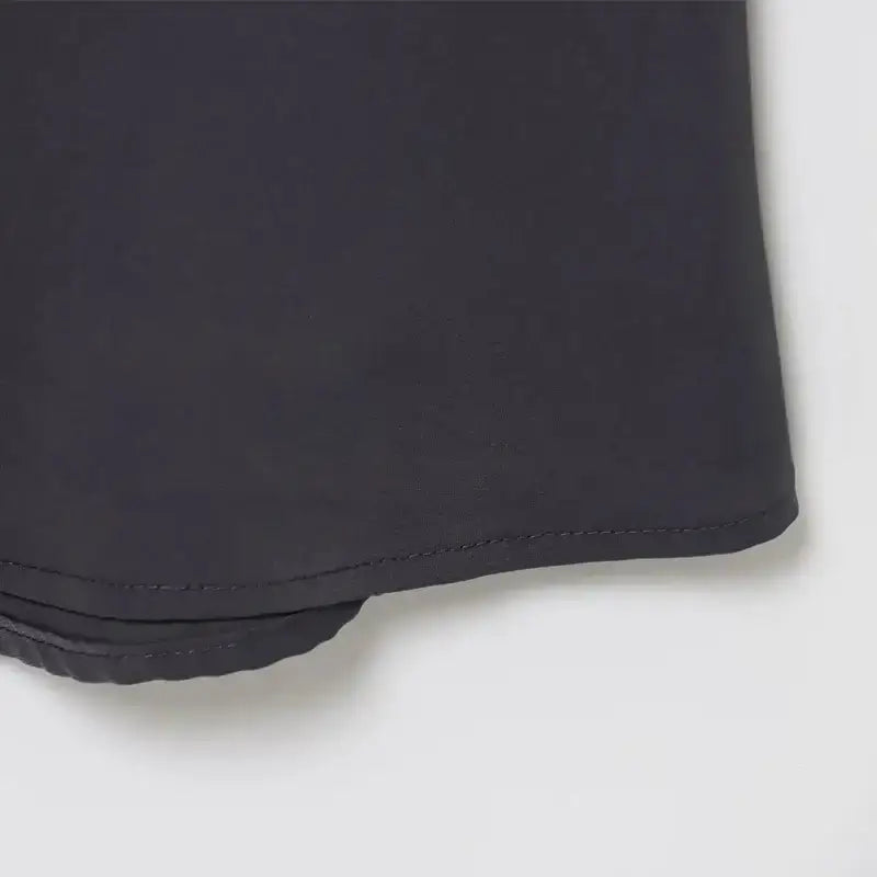 Close-up of black fabric detail on sleeveless backless midi dress from The Lady's Haven Boutique
