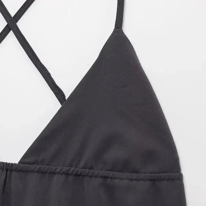 Close-up detail of black sleeveless backless midi dress with thin straps from The Lady's Haven Boutique