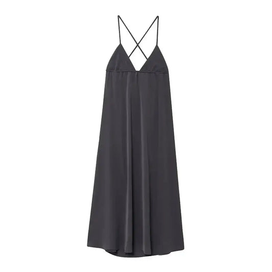Black sleeveless backless midi dress with thin crisscross straps from The Lady's Haven Boutique