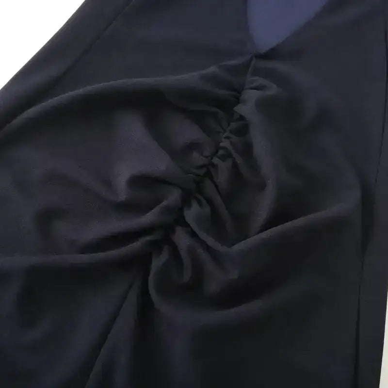Close-up of navy blue formal evening dress fabric showing gathered detail from The Lady's Haven Boutique