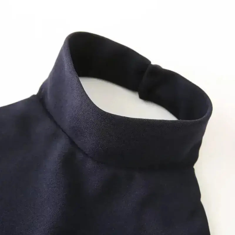 Close-up of navy blue formal evening dress high collar detail from The Lady's Haven Boutique