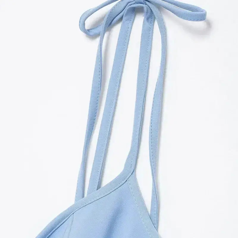 Close-up of straps on a blue mini party dress from The Lady's Haven Boutique