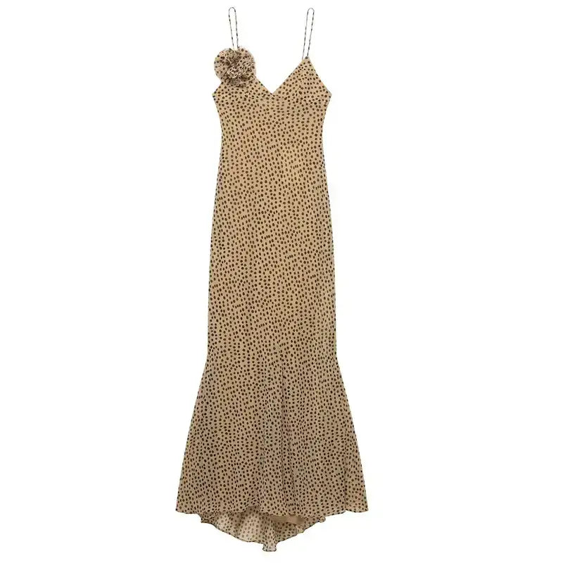 Elegant polka dot maxi dress with spaghetti straps and floral embellishment by The Lady's Haven Boutique