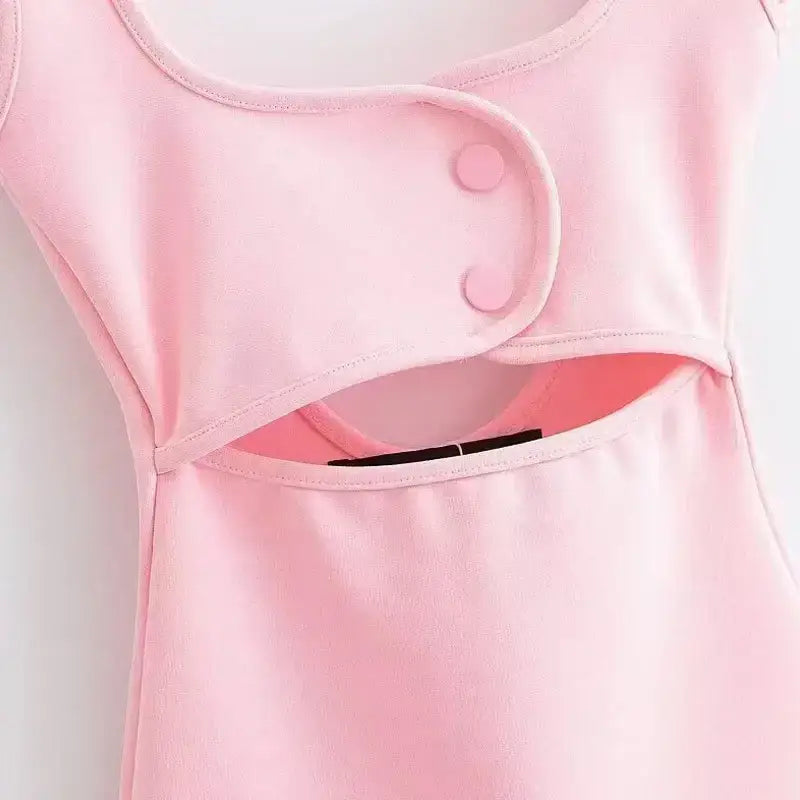 Close-up of pink mini slip dress with button detail from The Lady's Haven Boutique