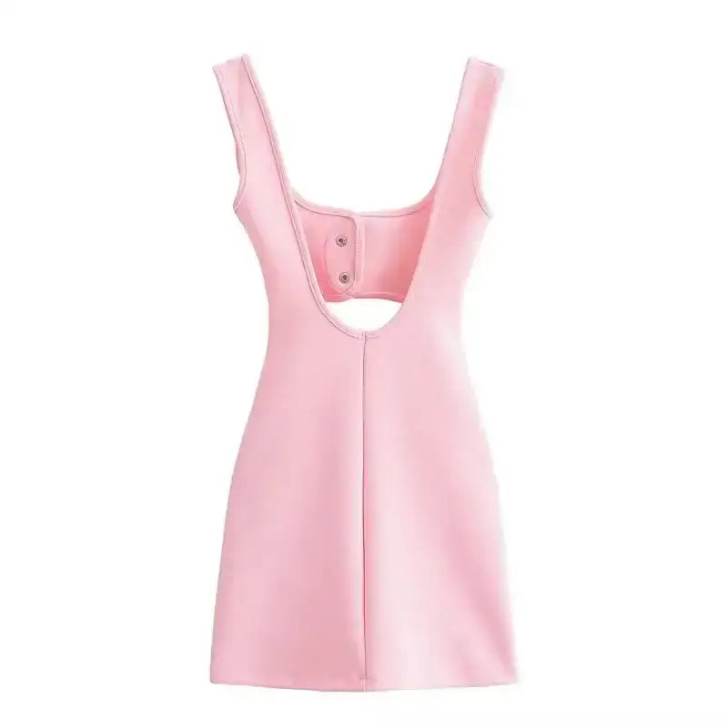 Pink sleeveless mini slip dress with open back and snap button detail from The Lady's Haven Boutique
