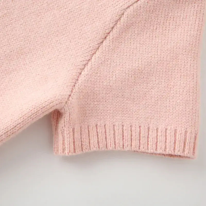 Close up of soft pink knit fabric on fashion lightweight cardigan from The Lady's Haven Boutique