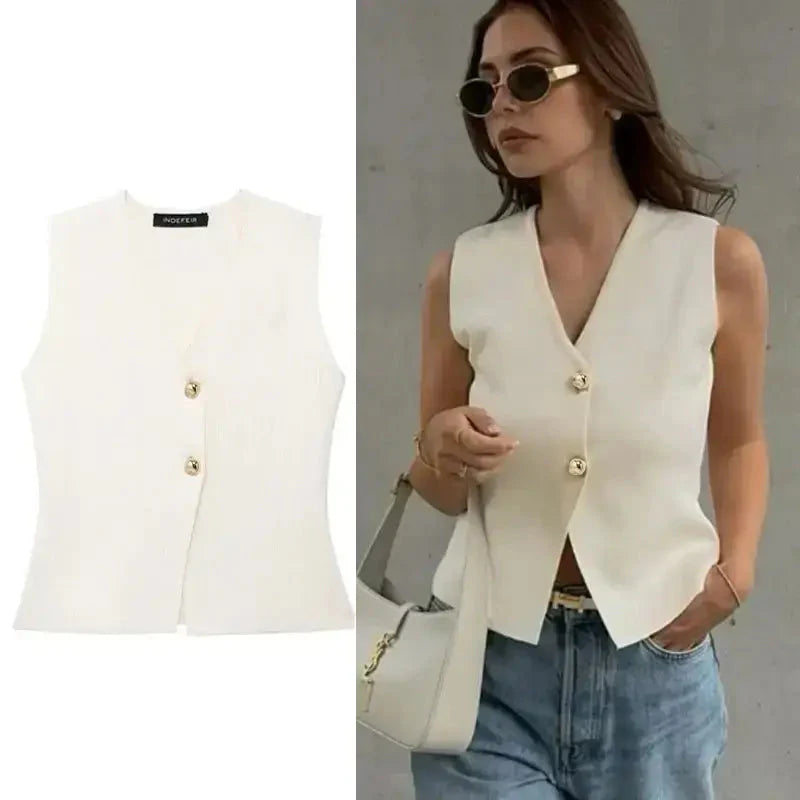 White crop sweater vest with gold buttons styled sleeveless for casual chic look