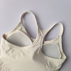 Light beige womens push up sports bra featuring padded cups and adjustable straps for comfort