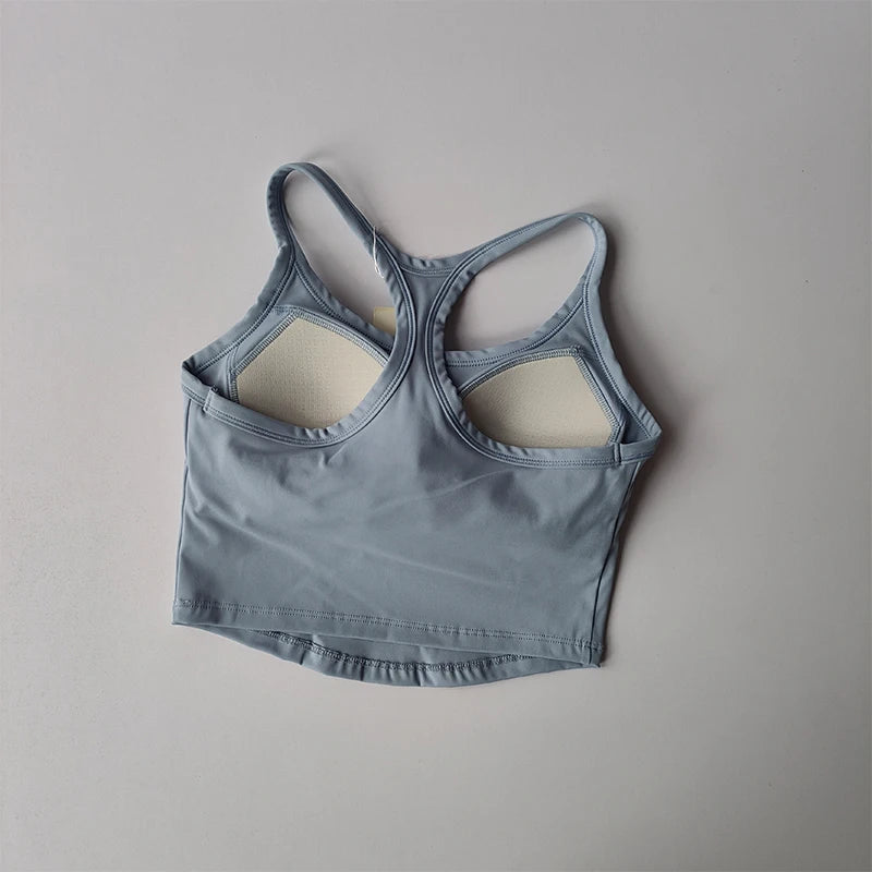 Light blue womens push up sports bra with a stylish back design for active comfort