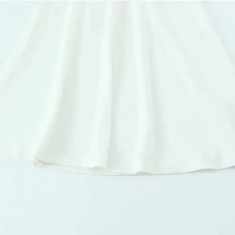 White off shoulder halter mini dress with flowy fabric detail from The Lady's Haven Boutique