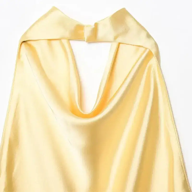 Yellow satin halter crop top with draped neckline from The Lady's Haven Boutique